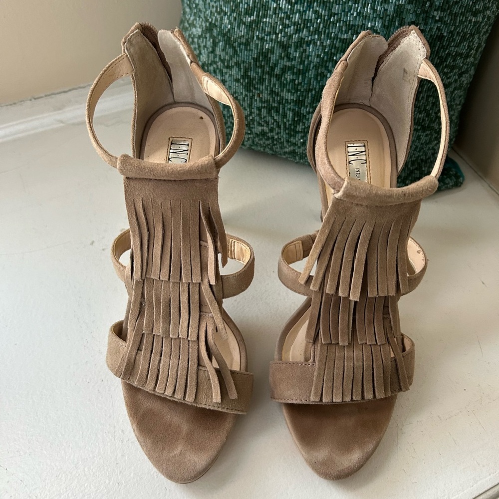 Beige suede sandals with fringe. 
INC International Concepts